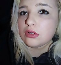 a lady is riding her large penis while laying on the bed